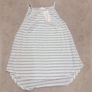 White and grey tank top with tag still on. Size small.